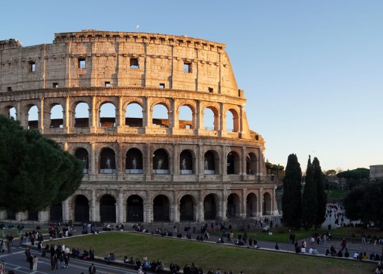 Colosseum in Rome with people exploring the iconic landmark