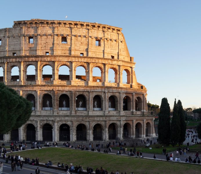 Colosseum in Rome with people exploring the iconic landmark