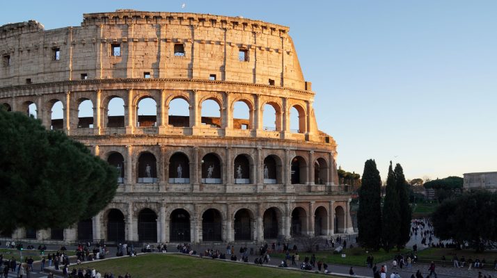 Colosseum in Rome with people exploring the iconic landmark