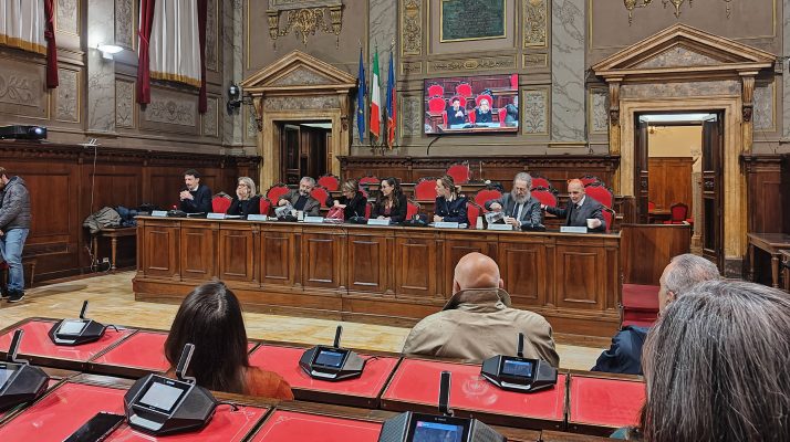 Interior of Palazzo Valentini's Sala Consiliare during an event on women's violence.