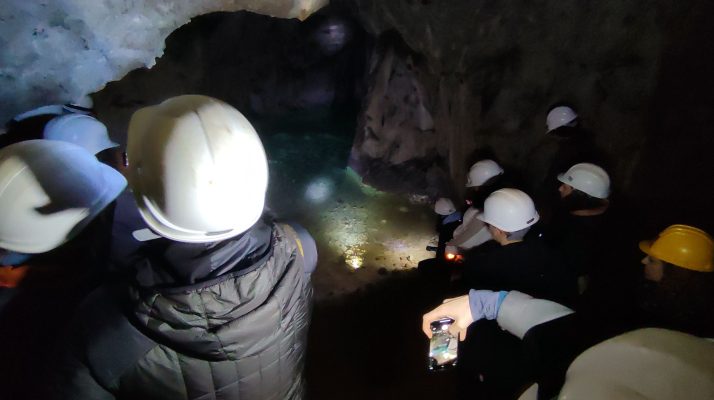Visitors explore the underground quarry galleries beneath the Temple of Claudius in Rome.