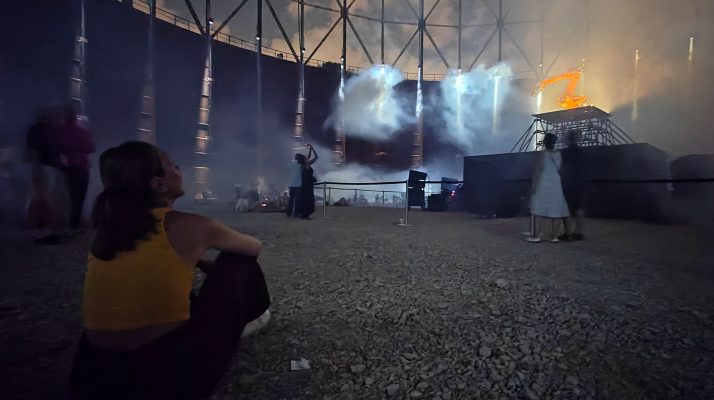 Interior view of Gazometro during Videocittà festival with people observing light installations.