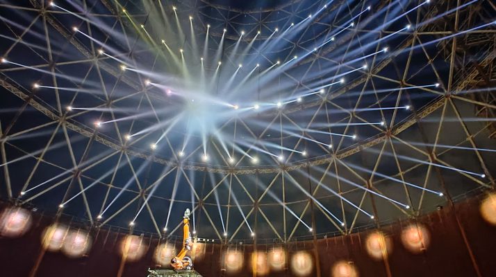 Interior of Gazometro in Rome with beams of light and steel framework during the Videocittà light festival 2025