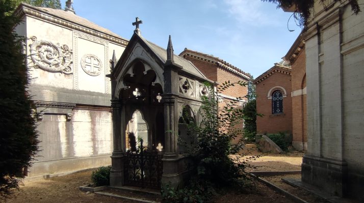 A view of historic tombs and neoclassical architecture at the Monumental Cemetery of Verano in Rome.
