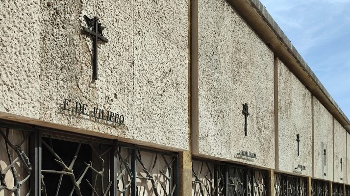 Tomb of Edoardo De Filippo at Verano Cemetery in Rome, showcasing neoclassical architecture and artistry.